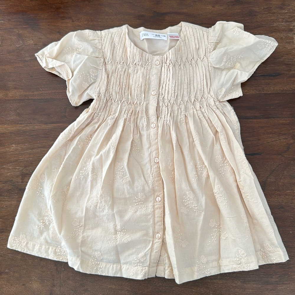 Cotton dress with embroidered flowers. Excellent condition. Never been worn.